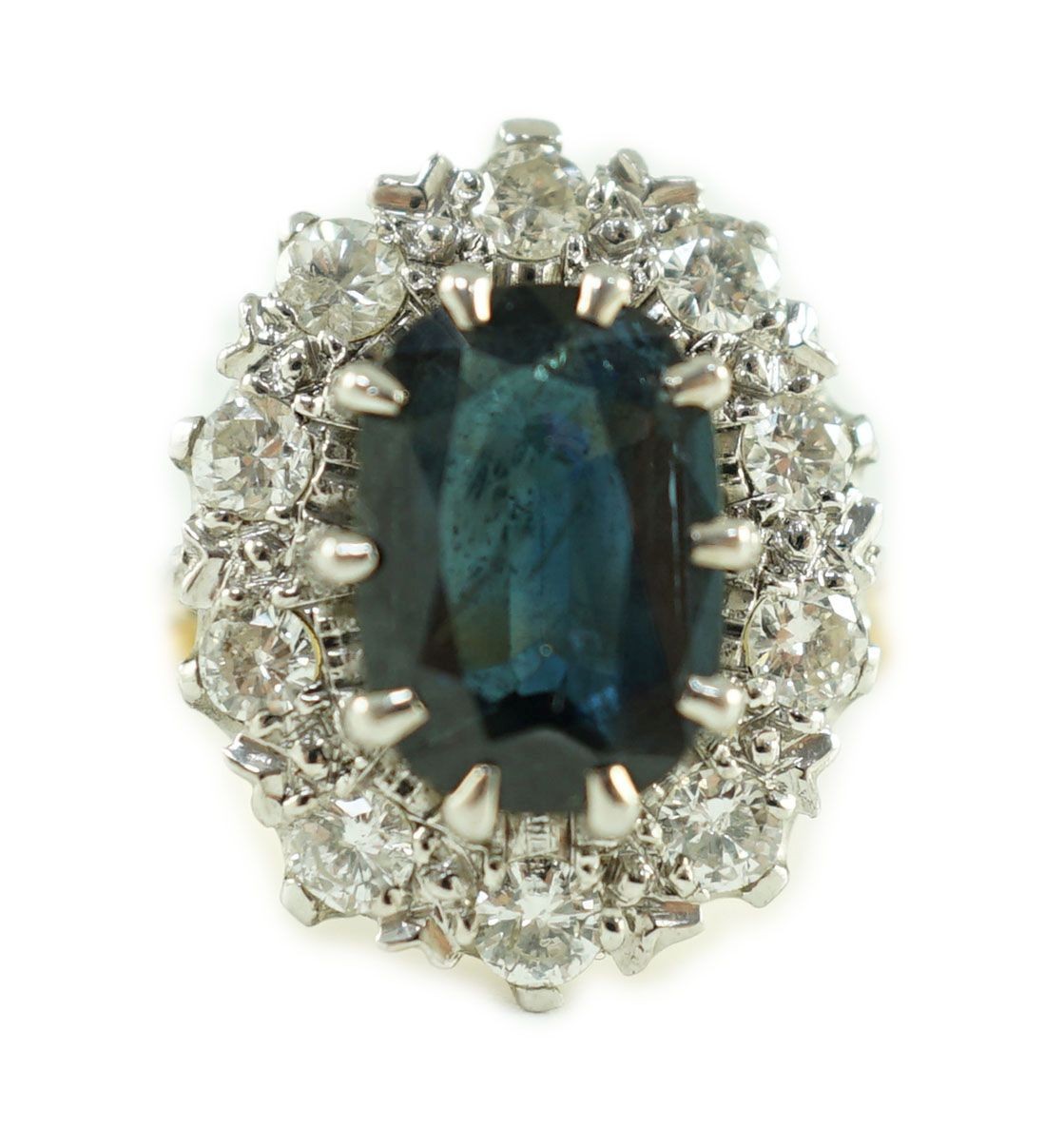 An 18ct gold, sapphire and diamond set oval cluster dress ring